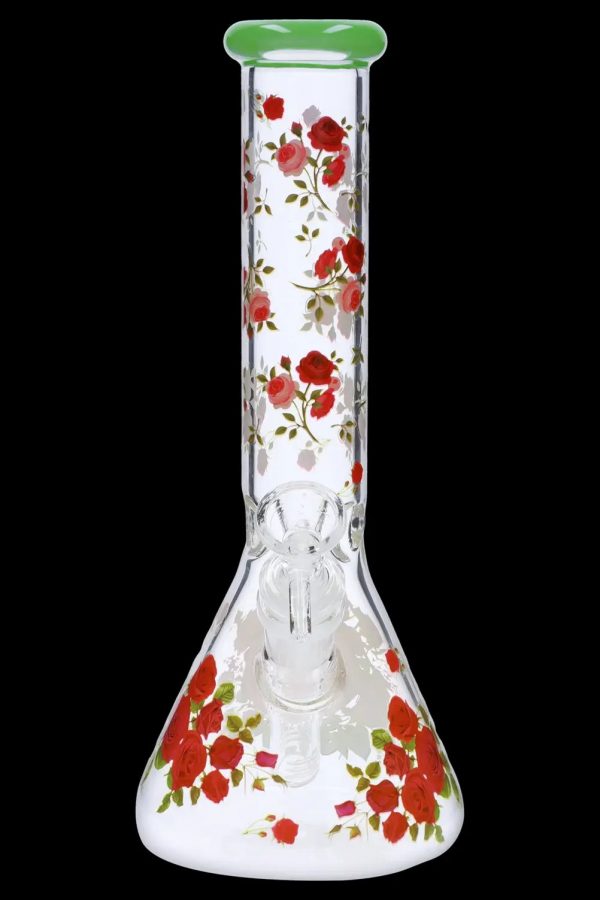 Glass bong decorated with red roses and green rim, against a black background.