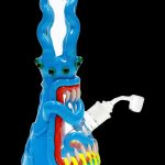 Blue glass water pipe shaped like a monster with glowing red eyes and jagged teeth.