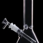 Clear glass bong with blue accents, isolated on black.