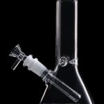 Clear glass bong with removable downstem and bowl against a black background.