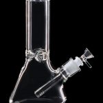 Clear glass bong against a black background.