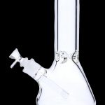 Clear glass water pipe (bong) isolated on a black background.