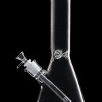 Clear glass bong with ice catcher, isolated on black.