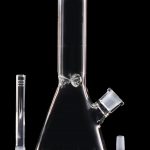 Clear glass bong with downstem and bowl, displayed with a separate glass tube.