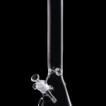 Clear glass bong against a black background.