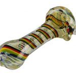 A close-up view of the Worked Rasta Spoon Glass Pipe, showcasing its curved shape and translucent glass material.