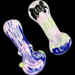 A close-up, angled view of the Worked Slime Strands Hand Pipe, showcasing its colorful glass swirls against a dark backdrop.