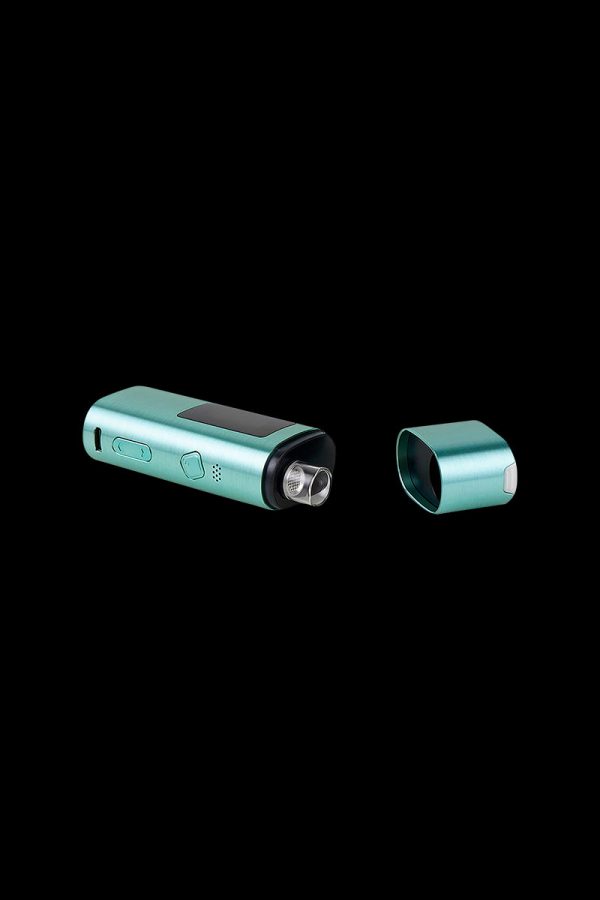 Teal cannabis vaporizer pen disassembled, showing the device body and mouthpiece separated on a black background.