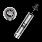 Silver cannabis vaporizer pen with digital display and removable herb chamber.