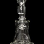 Clear glass water pipe (rig) with intricate design, isolated on a black background.