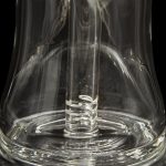 Close-up of a clear glass bong with intricate swirling patterns.