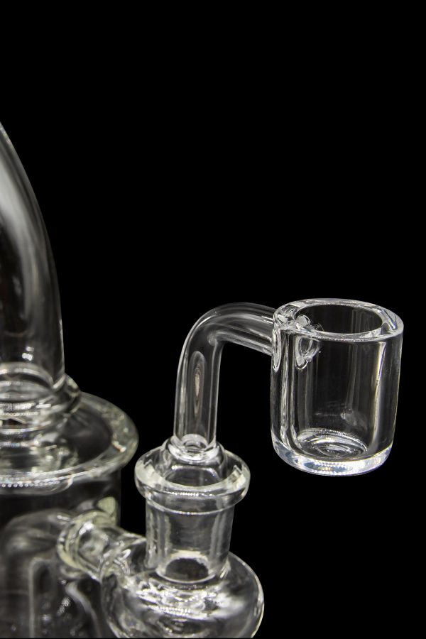 Clear glass dab rig with a quartz insert.