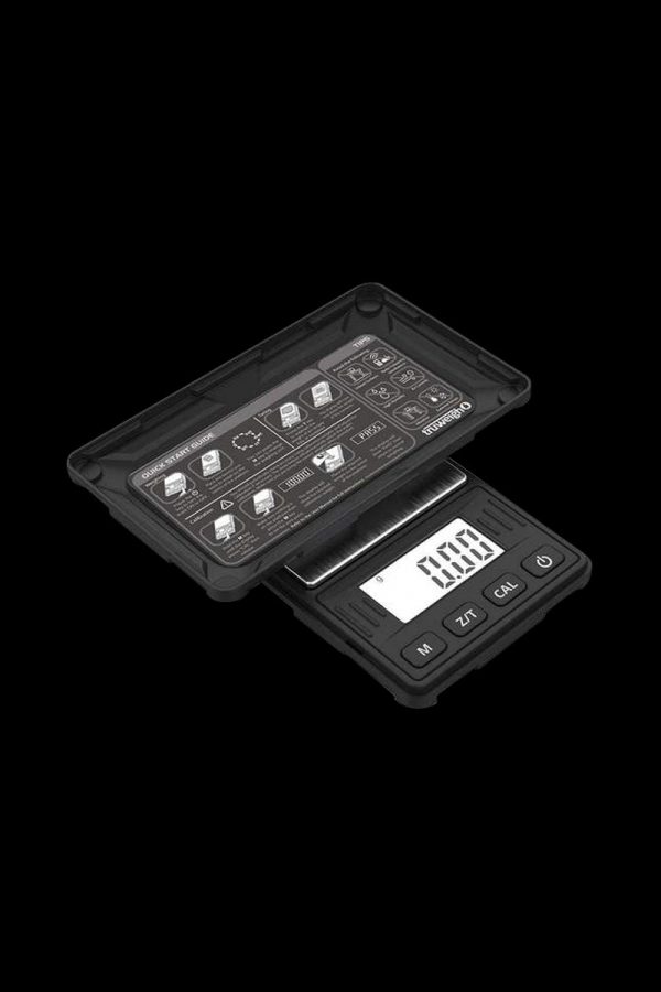 The Truweigh Riot Scale - 100g x 0.01g is shown in a top-down view, featuring a digital display and black finish.
