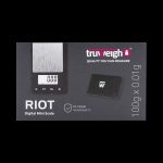 A close-up, angled view of the Truweigh Riot Scale, displaying a digital readout on its black surface.