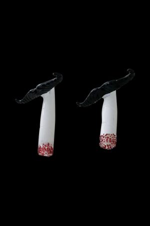 A studio shot of the Mustache Cig One Hitter, showcasing its clean lines and minimalist design against a stark black background.