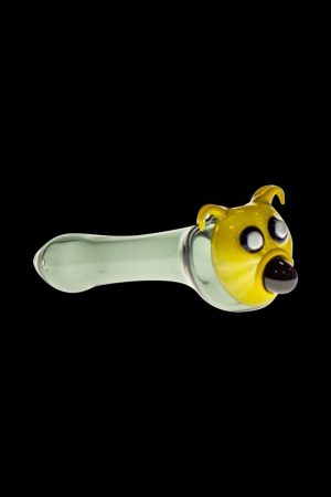 A side view of the Yellow Dog Glass Spoon Pipe, showcasing its curved shape and glossy yellow finish.