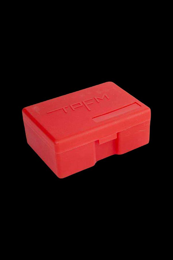 Red silicone smell-proof container with "TPFM" embossed on top.