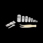 Cannabis calibration weights and scoop on a black background.