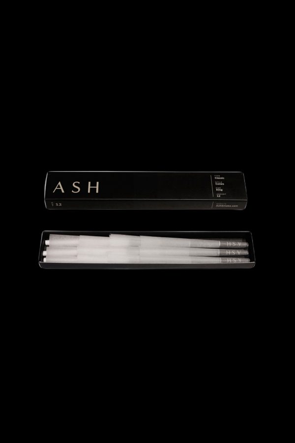 Pack of pre-rolled cannabis cones with minimalist black and white packaging, branded "ASH."