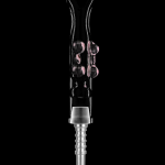 Silver dab rig with pink cannabis concentrate.