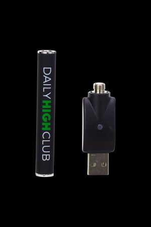 Cannabis vape pen and USB charger on a black background.