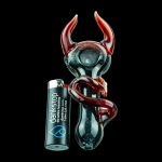 A detailed studio shot of the Little Devil Hand Pipe, showcasing its sculpted, dark-colored design against a plain black backdrop.