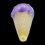 A close-up, angled view of the Single Scoop Ice Cream Spoon Pipe, showcasing its sculpted glass form and vibrant color scheme.