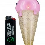 The Single Scoop Ice Cream Spoon Pipe is shown in a close-up, angled view highlighting its colorful, sculpted design.