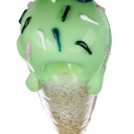 A close-up, angled view of the Single Scoop Ice Cream Spoon Pipe, featuring a smooth, sculpted design in shades of green.