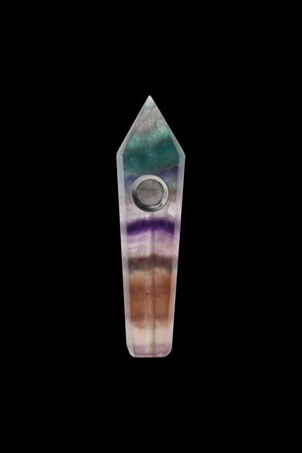 Front view of the Stone Pipe, a slender, textured pipe with a dark background emphasizing its form.