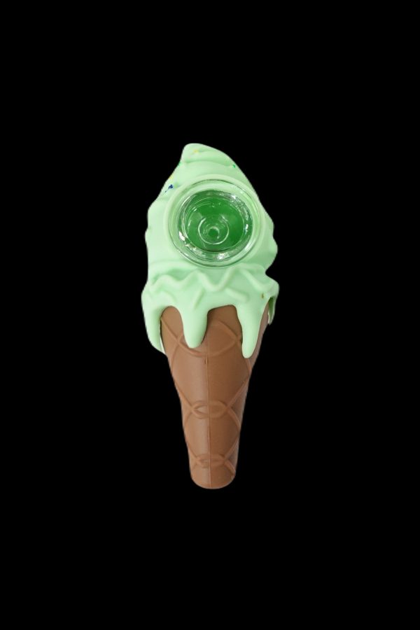 A glass ice cream cone-shaped water pipe with a mint-green “ice cream” top and a brown cone base, isolated on a black background.