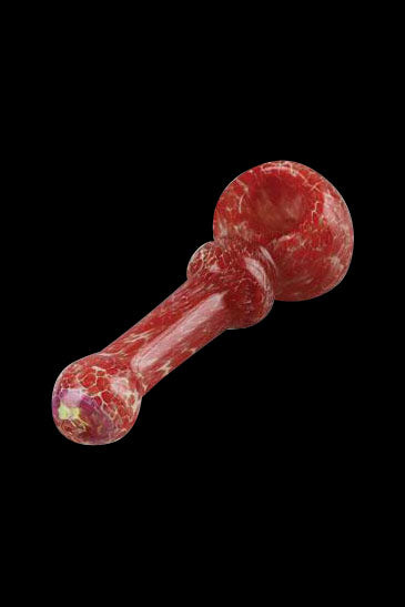 Red glass pipe with marbled pattern against a black background.