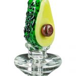 The Empire Glassworks Avocadope Carb Cap for Puffco Peak is displayed in a side view, showing a green and yellow glass cap.