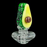 The Empire Glassworks Avocadope Carb Cap for Puffco Peak is shown in a close-up, angled view, showcasing its detailed, avocado-inspired green and brown glass design.