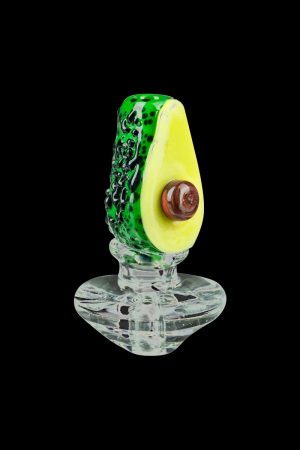 The Empire Glassworks Avocadope Carb Cap for Puffco Peak is shown in a close-up, angled view, showcasing its detailed, avocado-inspired green and brown glass design.