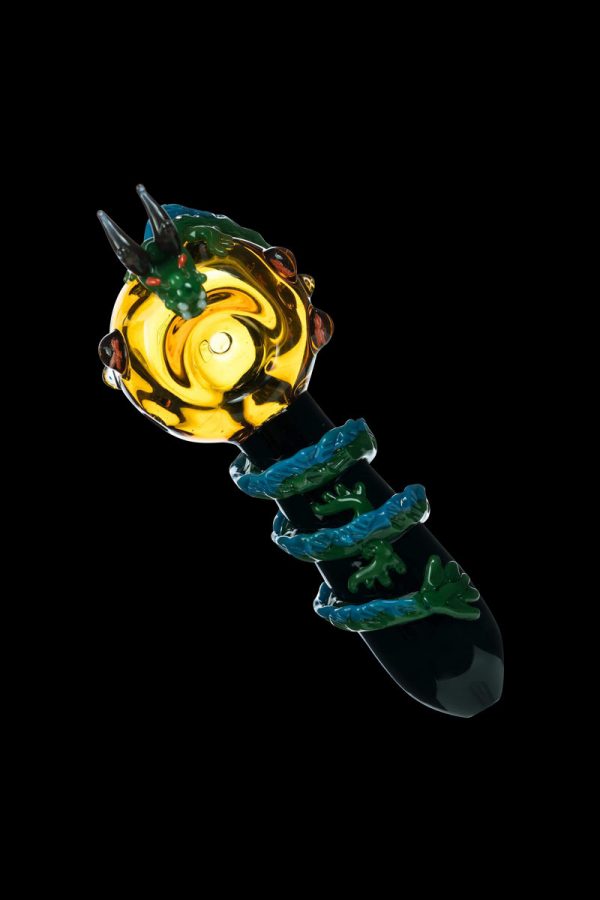 A detailed side view of the Empire Glassworks Dragon Sphere Small Spoon Pipe, showcasing its vibrant, swirling glass design.