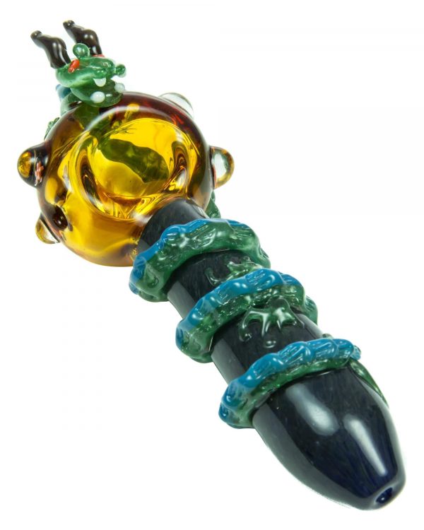 A close-up view of the Empire Glassworks Dragon Sphere Small Spoon Pipe, displaying a colorful glass design.