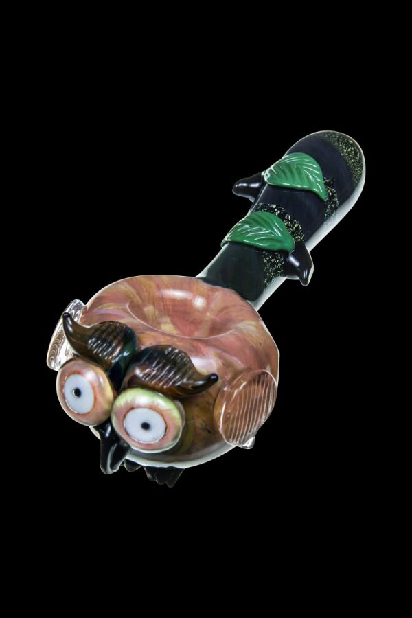 A detailed side view of the Empire Glassworks "The Owl" Mini Glass Spoon Pipe, featuring sculpted owl facial details in vibrant colors.
