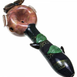 A detailed side view of the Empire Glassworks "The Owl" Mini Glass Spoon Pipe, featuring sculpted feather details and a rich amber hue.