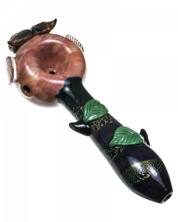 A detailed side view of the Empire Glassworks "The Owl" Mini Glass Spoon Pipe, featuring sculpted feather details and a rich amber hue.