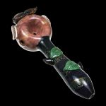 A side view of the Empire Glassworks "The Owl" Mini Glass Spoon Pipe, featuring sculpted details resembling an owl’s face.