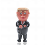 Front view of the Empire Glassworks “Agent Orange” Trump hand pipe, a sculpted, orange-toned figurine presented on a plain white background.