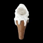 Ice cream cone-shaped glass pipe with dripping white “ice cream” against a black background.