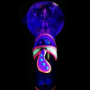 Glow-in-the-dark glass pipe shaped like a mushroom against a black background.