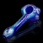 Blue glass pipe with textured surface, studio shot.