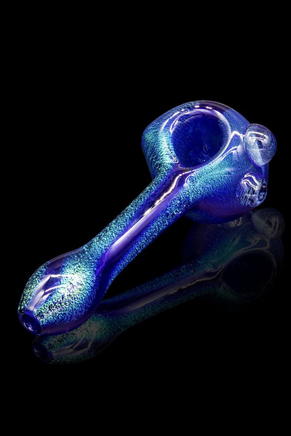 Blue glass pipe with textured surface, studio shot.