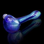 Blue glass pipe with iridescent shimmer, studio shot on a reflective black surface.