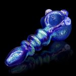 Blue glass pipe with intricate swirling patterns, isolated on a black background.