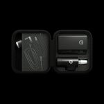 Black zippered case open to reveal a cannabis concentrate vaporizer pen and accessories on foam inserts.
