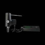 Black Grenco Science G Pen Elite vaporizer with charging dock.